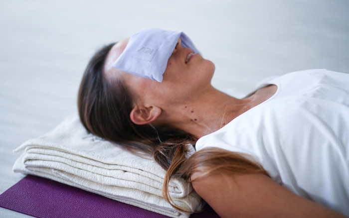 Student practices Restorative Yoga with props Student practices Restorative Yoga with props