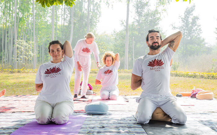 An instructor uses props to teach Yin Yoga An instructor uses props to teach Yin Yoga