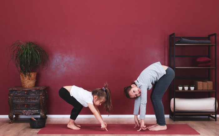 Two children practice mindful yoga for kids Two children practice mindful yoga for kids