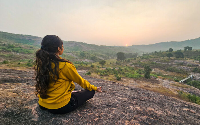 A woman practices yoga while traveling A woman practices yoga while traveling