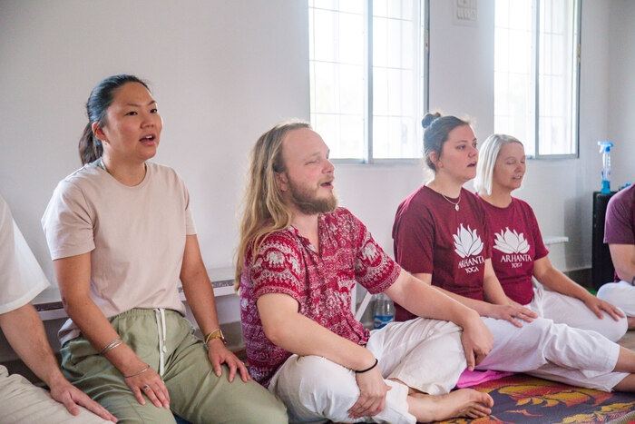 Group of yoga students chant mantras for peace Group of yoga students chant mantras for peace