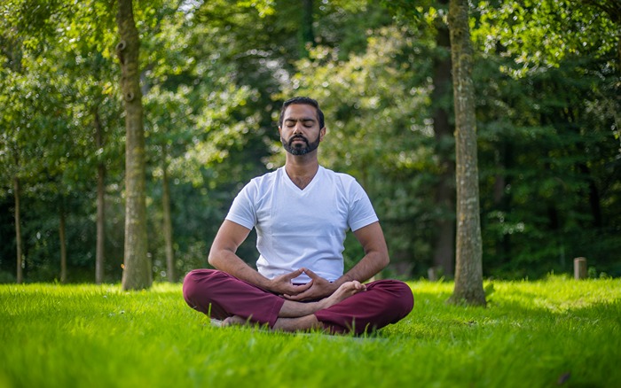 a yoga practioner sits deeply with his thoughts during svadhyaya a yoga practioner sits deeply with his thoughts during svadhyaya