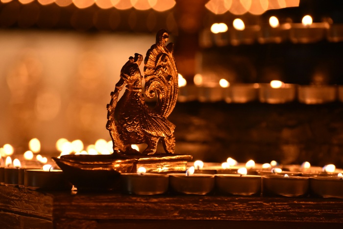 Diyas lit around idol in Diwali Diyas lit around idol in Diwali