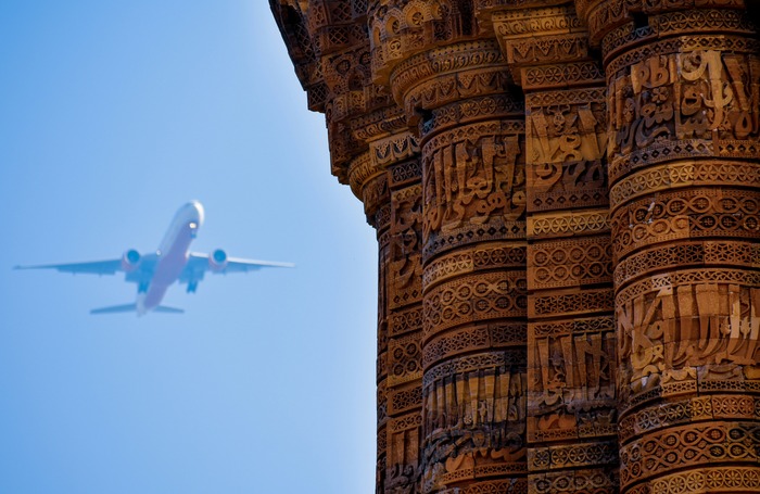 Airplane flying over a temple in India Airplane flying over a temple in India