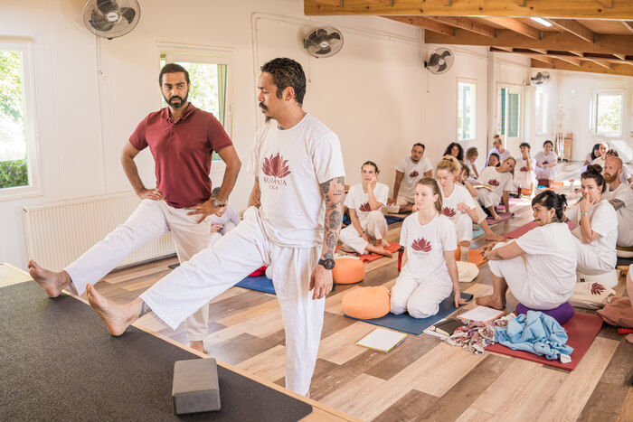 Yoga teacher teaching poses for tight hips Yoga teacher teaching poses for tight hips