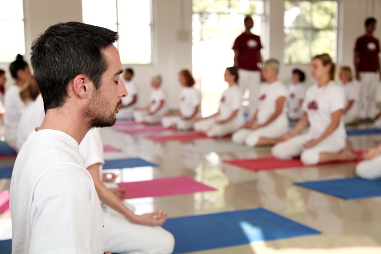 Group practice of Sukhasana or Easy pose Group practice of Sukhasana or Easy pose