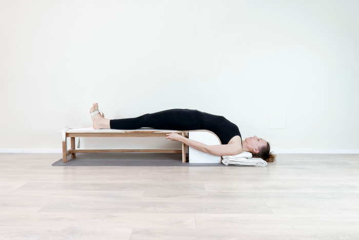 Setu Bandha Sarvangasana supported bridge pose practiced with props Setu Bandha Sarvangasana supported bridge pose practiced with props