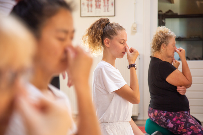 Students practicing Alternate Nostril breathing, also known as Nadi Shodhana Students practicing Alternate Nostril breathing, also known as Nadi Shodhana