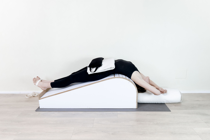 Supported Fish pose with props Supported Fish pose with props