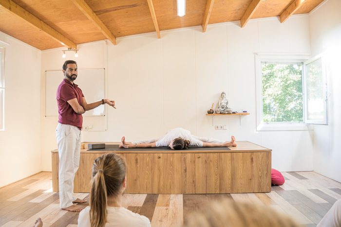Yin Yoga Students in Upavistha Konasana Variation Students practicing Yin variation of Upavistha Konasana