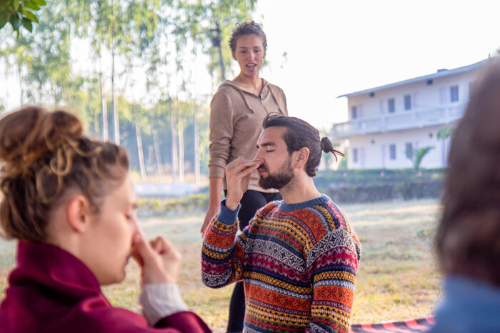 yoga-teacher-guiding-student-with-nadi-shodhana.jpg
