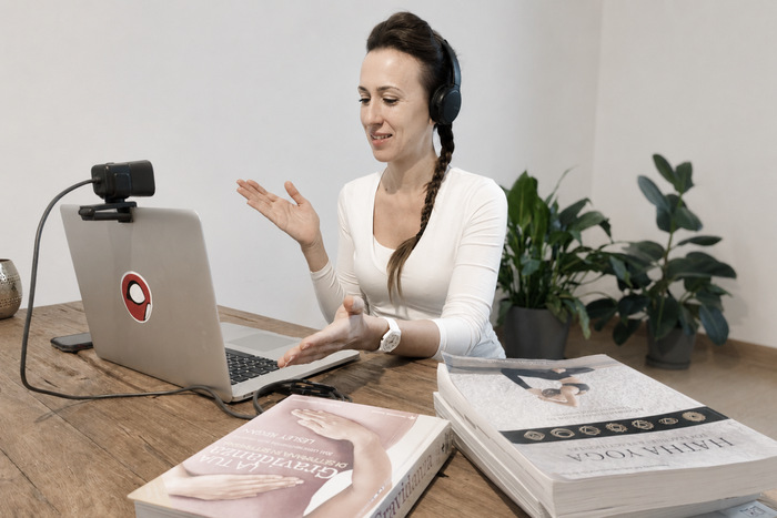 Yoga teacher leading online yoga classes